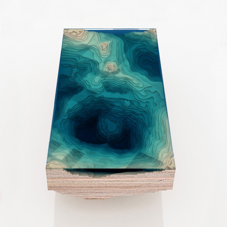 Gorgeous table uses multiple layers of glass and wood to replicate the sea bed