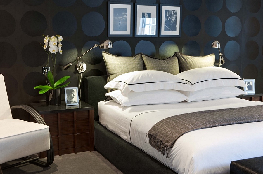 Graphic circles on the wall and the dark backdrop lend sophistication to the stylish bedroom