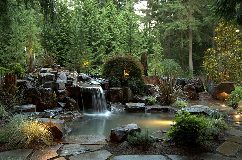 Heavy basalt rocks, dreamy waterfall and Japanese maple help shape the stunning pool retreat