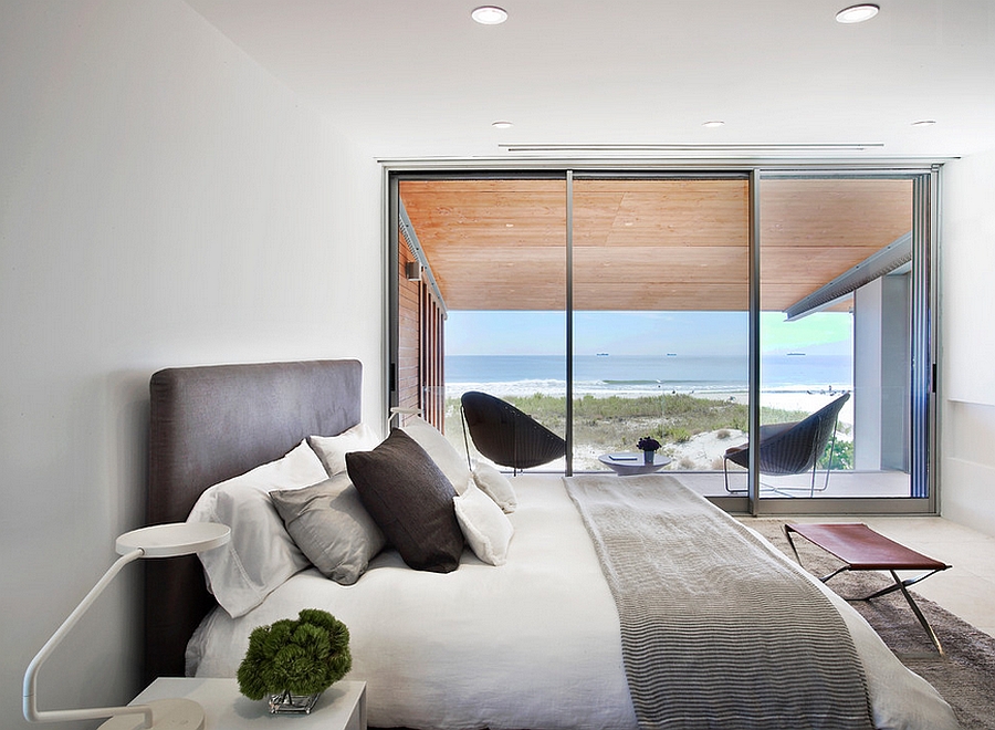 Hint of leather brings elegance to the amazing bedroom with ocean view