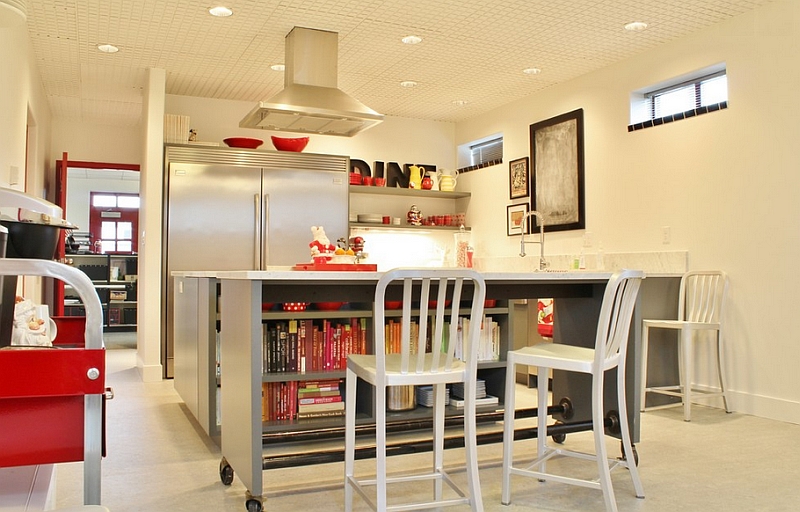 Industrial kitchen with island on casters and aluminum bar stools