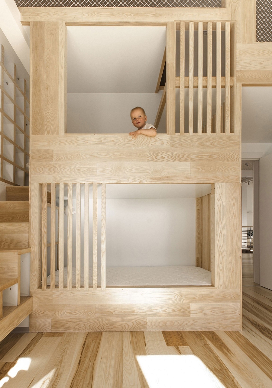 Large wooden structure with bunk beds for kids also comes with safety features