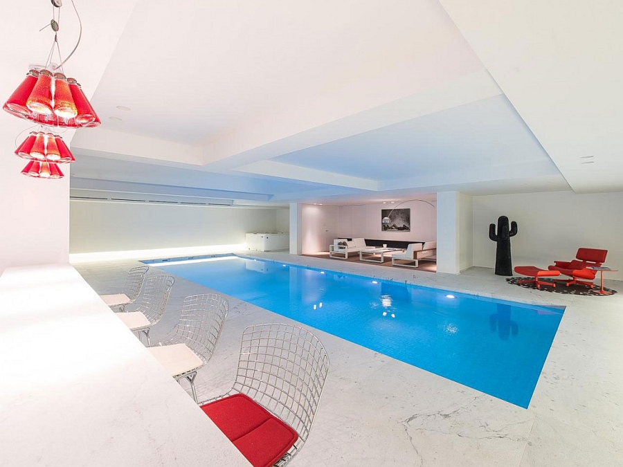 Lavish indoor pool with a home bar