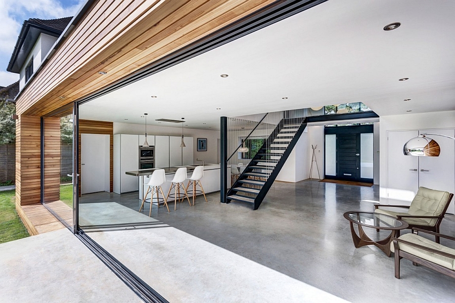 Living area and dining space of the house seamlessly connected with the outdoor deck