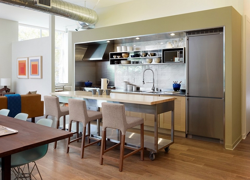 Long cart in the industrial kitchen doubles as the perfect kitchen island