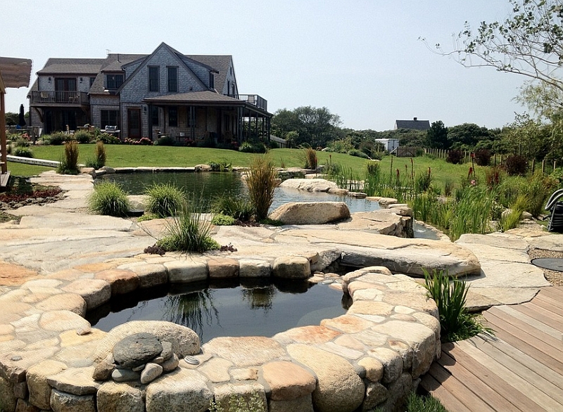Lovely stone and wood deck around the natural pool becomes a hip hangout on hot summer days