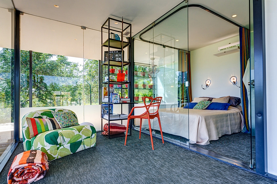 Masters Chair in bubbly orange complements the appeal of the glass cube bedroom perfectly