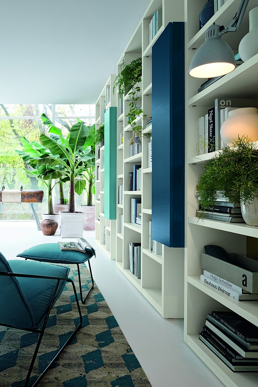 Natural greenery adds to the vibrant style of the wall unit system