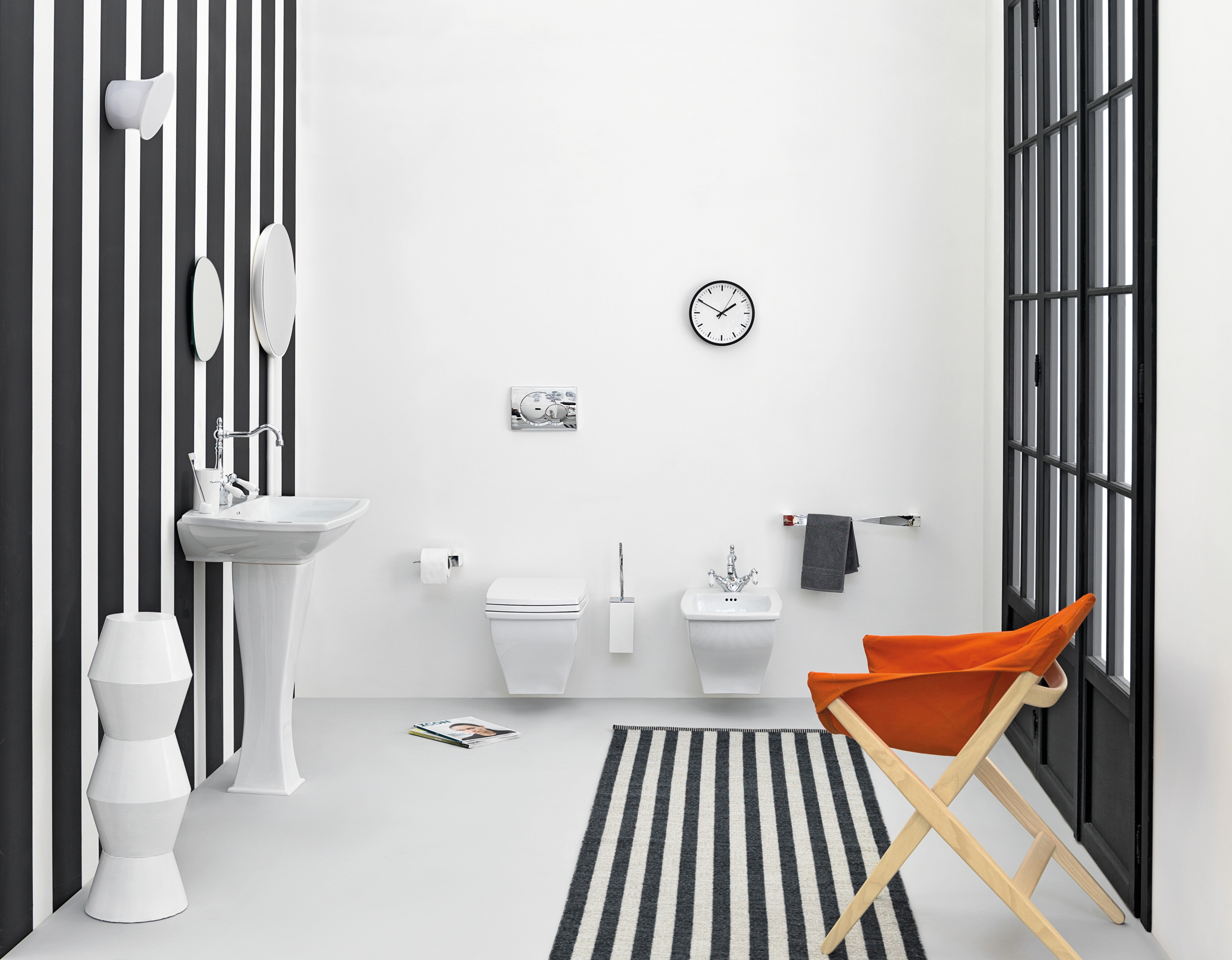 Orange accent chair looks captivating and fun in the cool black and white bath