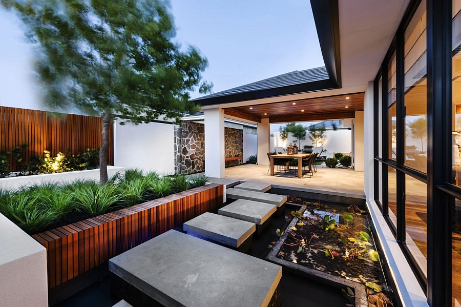 Outdoor water feature lends a tranquil appeal to the modern Perth home