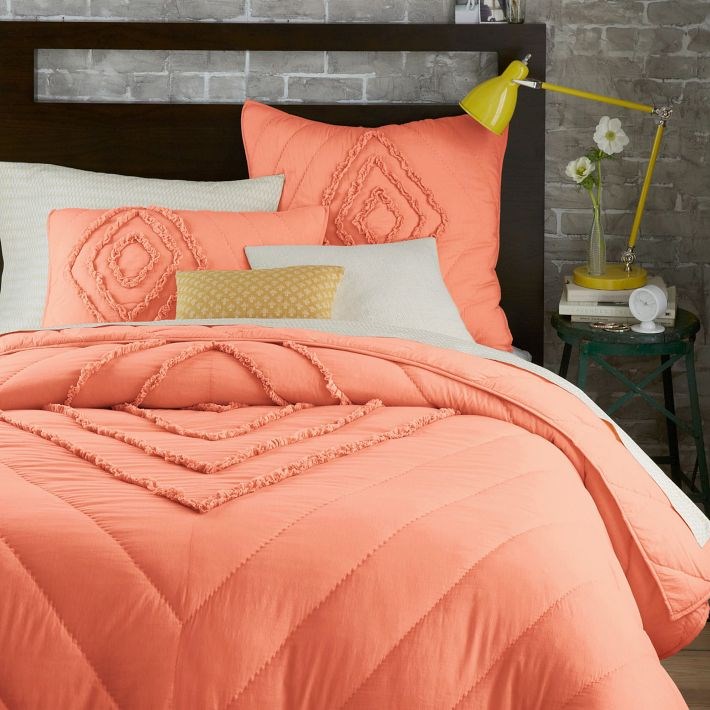 Peach bedding featuring diagonal lines