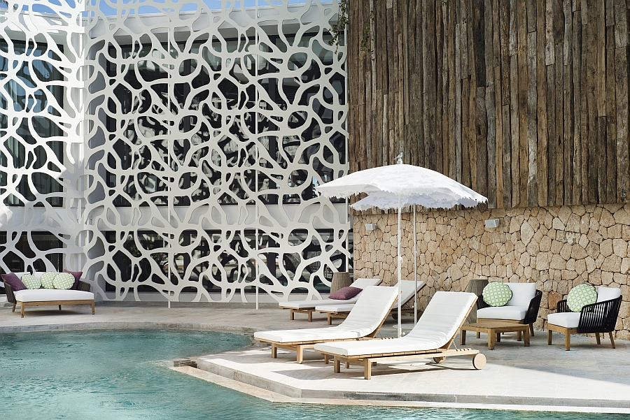 Poolside deck of the Hard Rock Hotel Ibiza with comfy Tribu Loungers