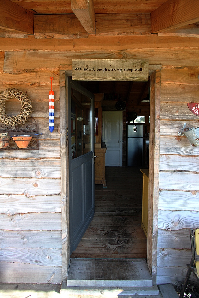 Rustic entry to the wood cabin in Normandy