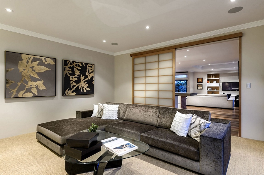 Shoji screen-styled sliding doors seperate the living room with the family area