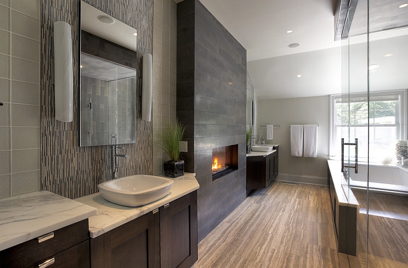 Sleek and polished bath with a fireplace at its heart