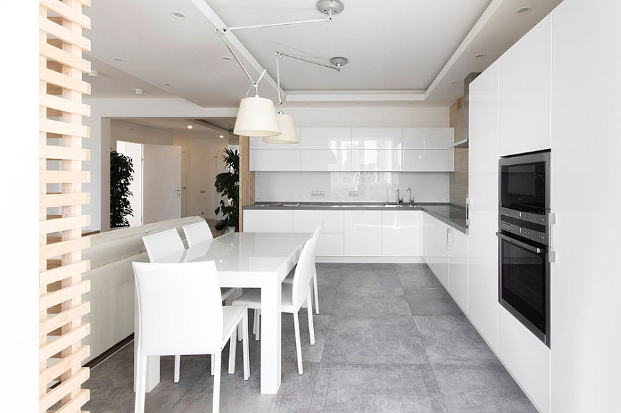 Sleek, elegant kitchen and dining area in white