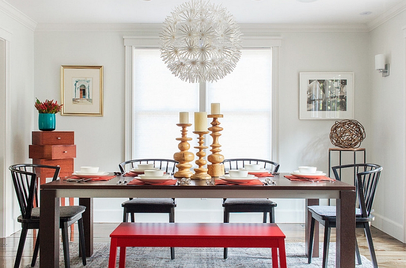 Smart dining room with lovely pops of color and a bold pendant light