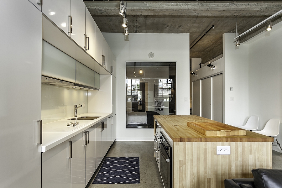 Smart modern kitchen in white with an ergonomic wooden island