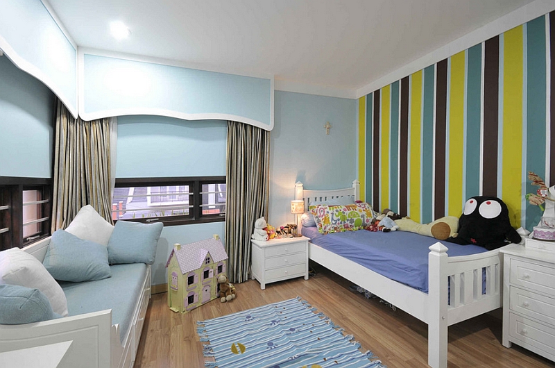 Smart striped wall makes the kids' bedroom seem larger