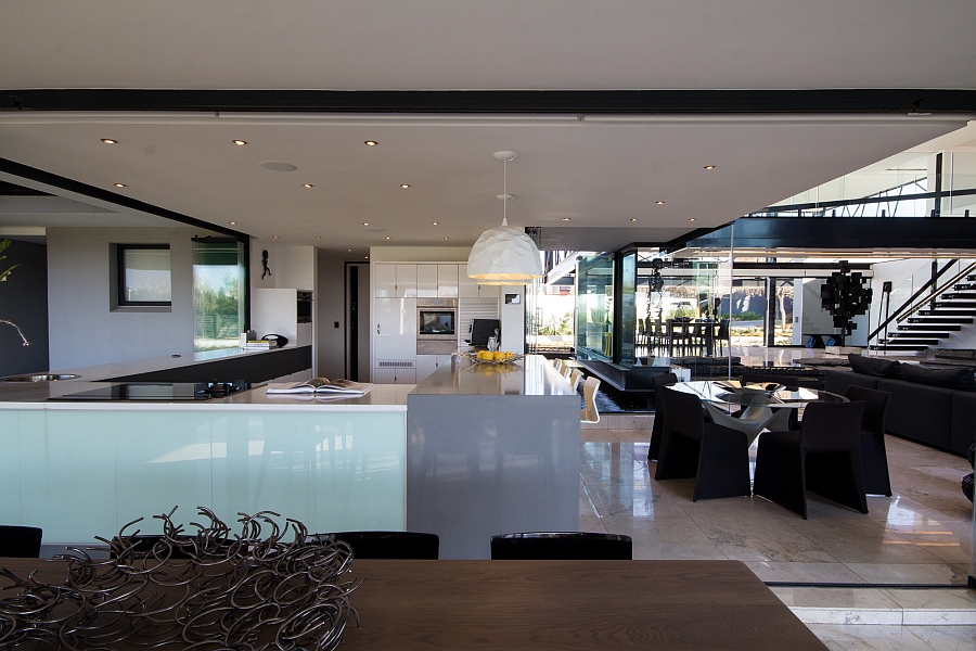 Spacious dining area and kitchen complement the glamorous living room perfectly