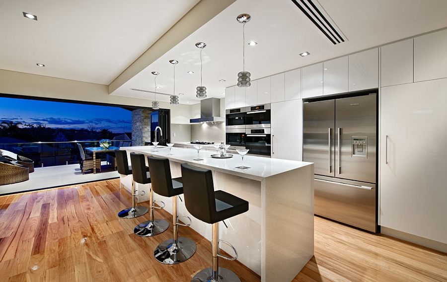 Spacious kitchen in white with a lovely island and smart seating