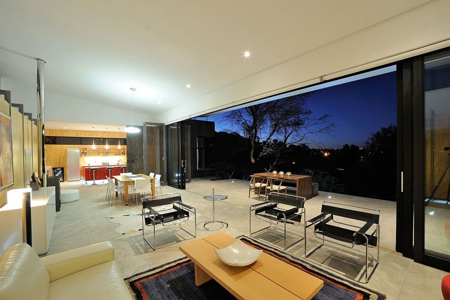 Stackable sliding glass doors connect the fabulous interior with the outdoor