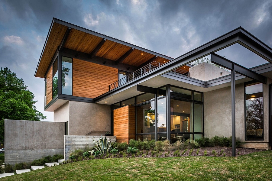 Steel and glass frame of the modern house extends the living space outdoors