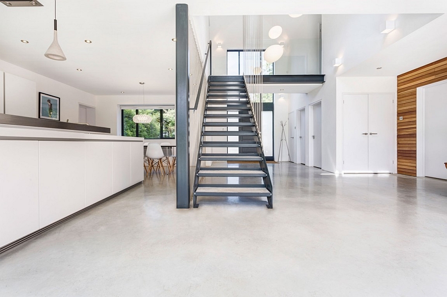 Steel wires hang around the staircase giving it a contemporary appeal