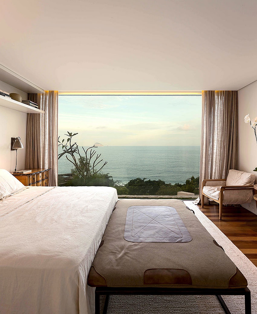 Stunning bedroom offers amazing view of the ocean in the distance