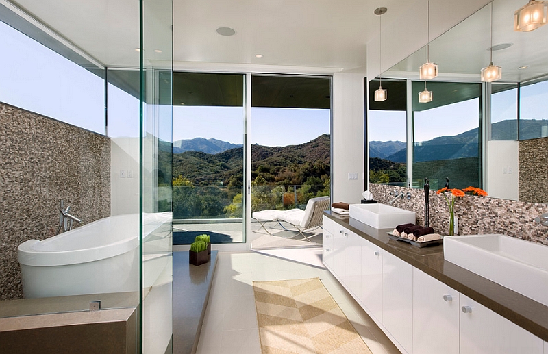 The hills in the distance add to the overall appeal of this spa-styled bathroom