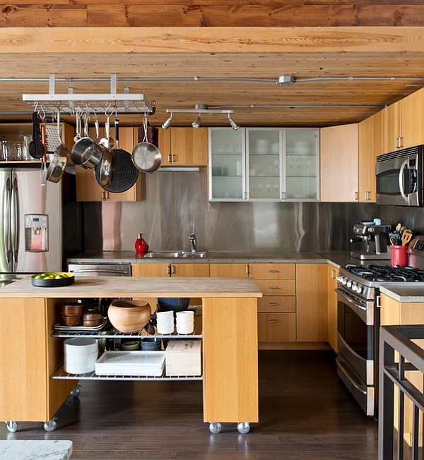 The pot rack drives home industrial appeal of this kitchen