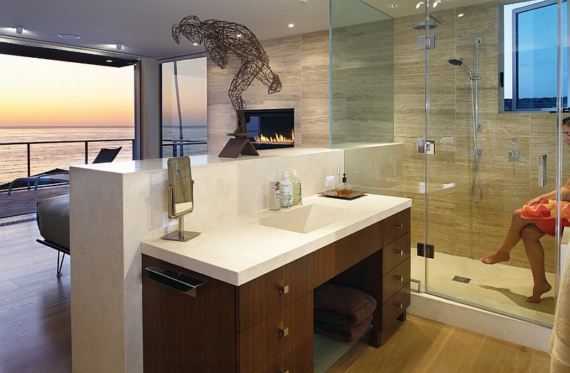 The visual of the fireplace and the ocean add to both the bedroom and the bath