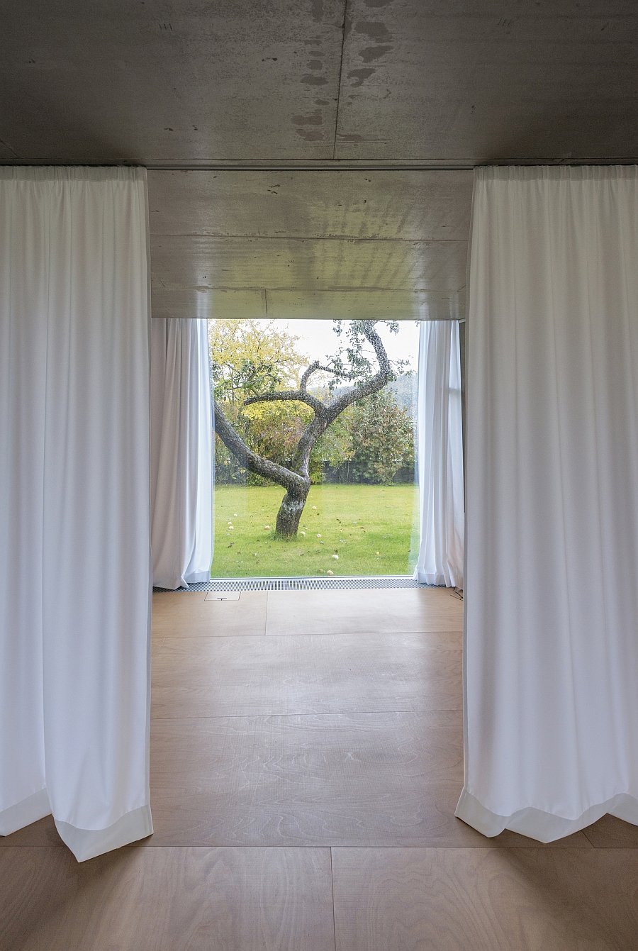 Track-mounted curtains allow you to shift between privacy and unabated views