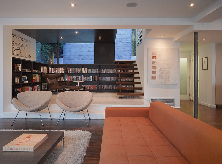 Twin orange slice chairs in the modern living room in Los Angeles [Design: Griffin Enright Architects]