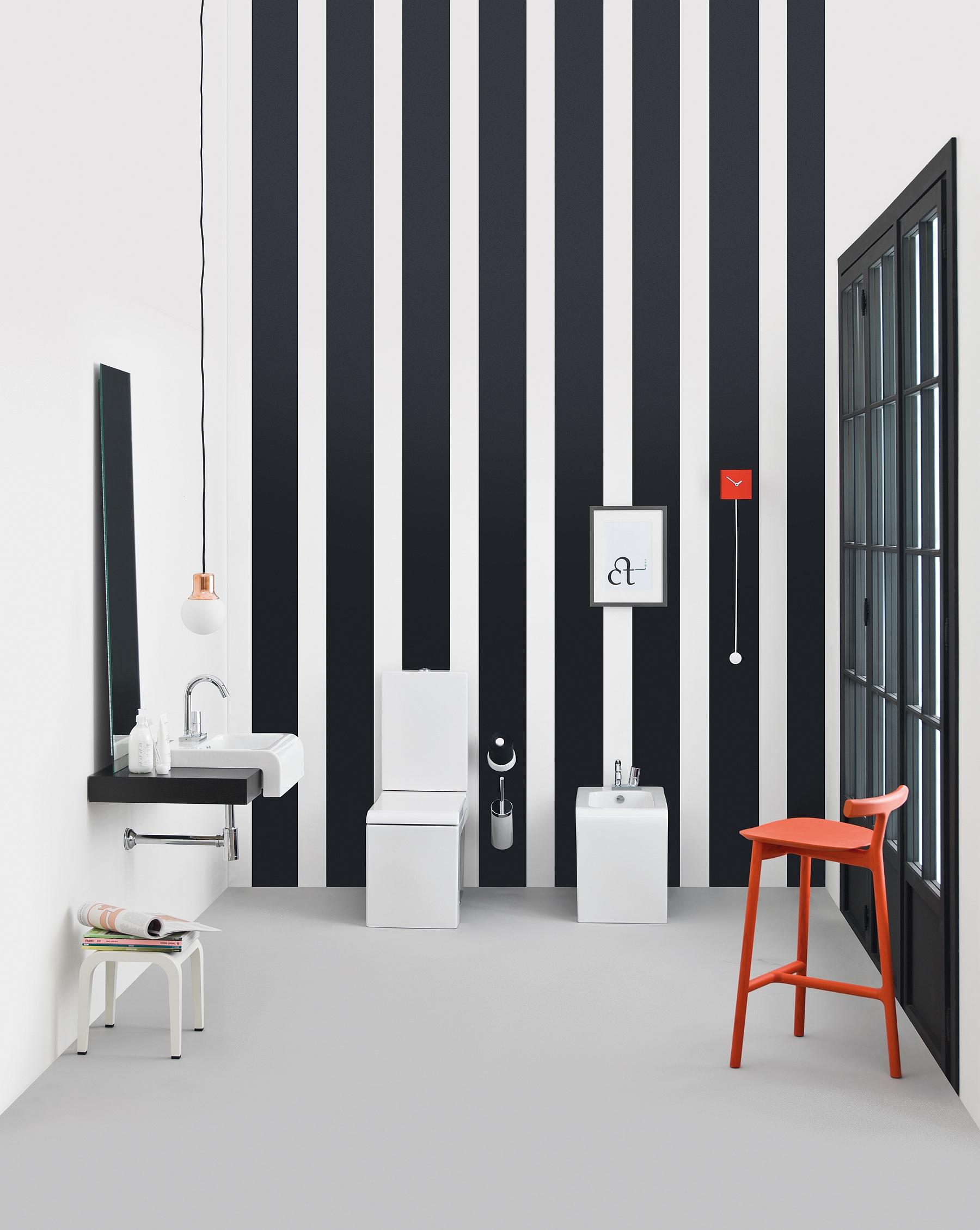 Vertical stripes, sleek sanitaries and pops of red in the blacka dn white bath inspiration