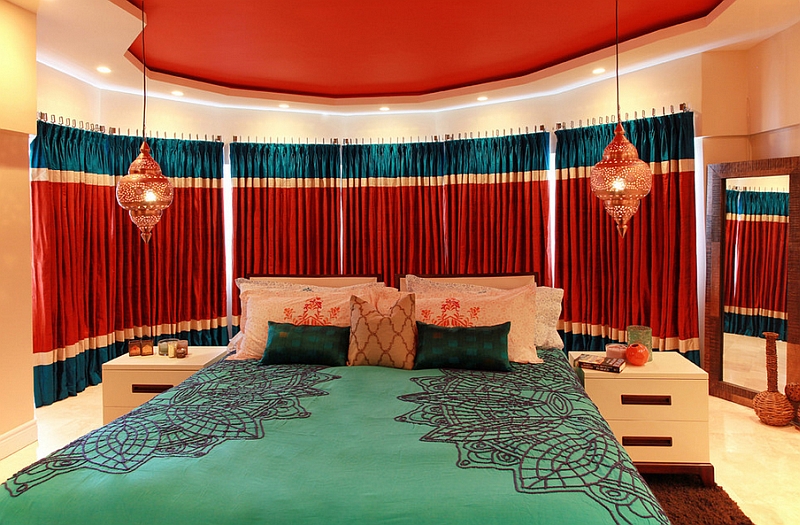 Warm, bright colors and lanterns shape a stunning Moroccan bedroom
