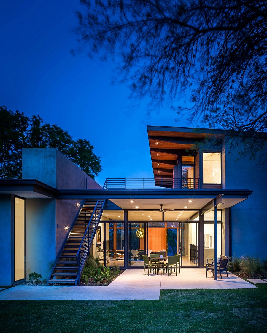 Warm lighting gives the trendy home a welcoming appeal after sunset