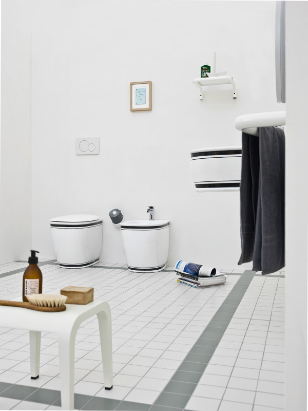 White wc and bidet with black edges and matching floating vanity in the toilet