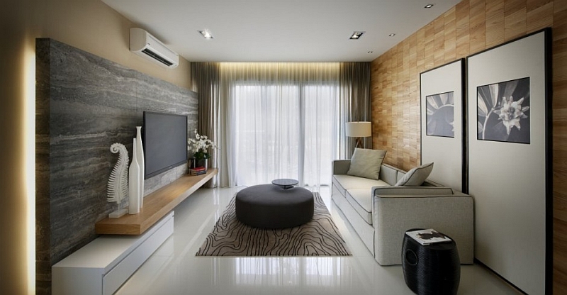 Wooden wall adds organic touches to the black and white living room