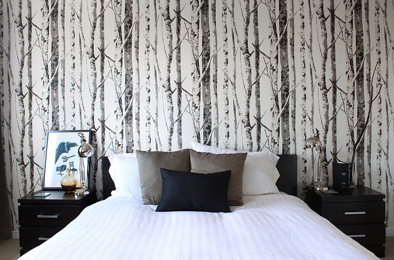 Woodsy wallpaper gives the cozy bedroom an entirely new look