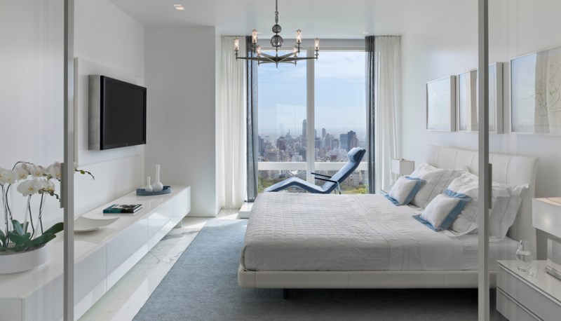 Abundant windows in a Manhattan bedroom designed by Jennifer Post