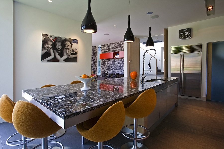 Beautiful pendant lights above the kitchen island add style to the space