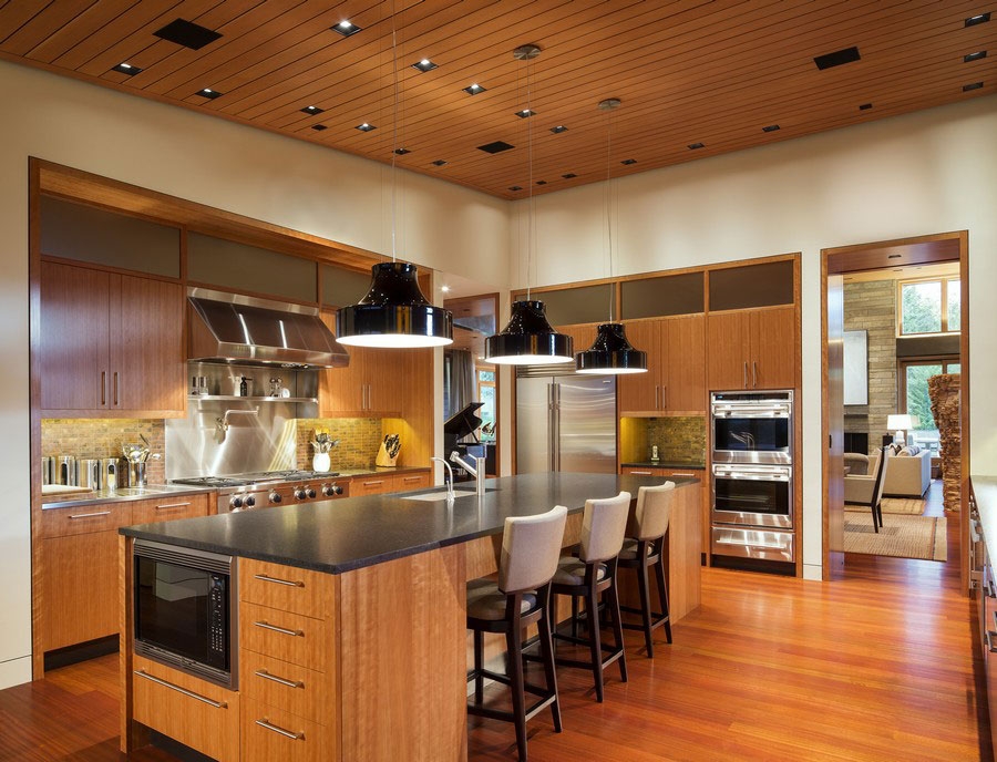 Bold black pendant lights enliven the cabin style bedroom