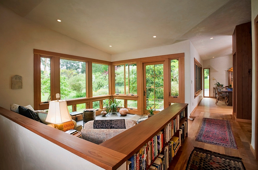 Book display used to demarcate the living area in a space-conscious fashion [Design: 450 Architects]