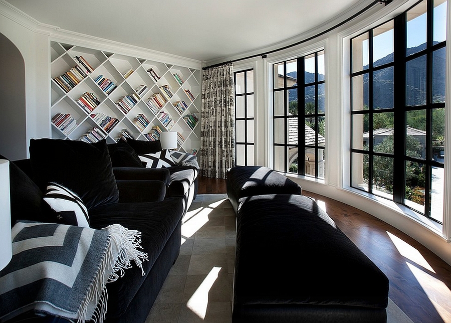Bookshelf adds a unique visual element to this contemporary family room [Design: Candelaria Design Associates]