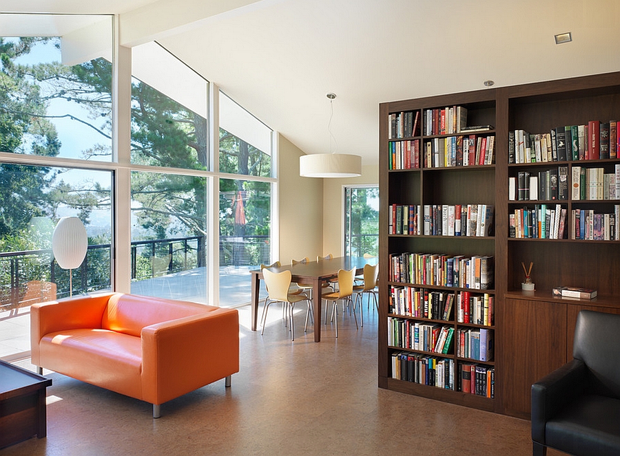 Bookshelf used as a room divider in the open floor plan [Design: Rossington Architecture] 