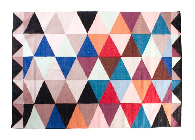 Colorful woven rug with geo triangles