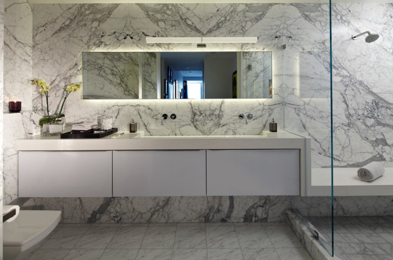 Contemporary bathroom with marble walls and flooring