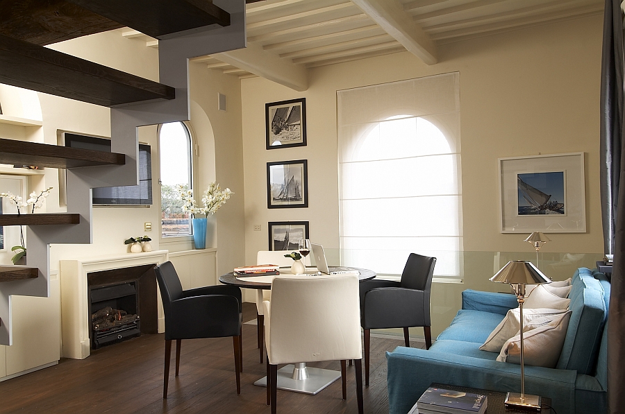 Dark wooden floor and ceiling beams bring old world charm to the contemporary suite