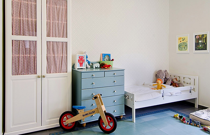 Elegant nursery with a chic wallpaper and cool colors